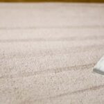 This is a photo of a carpet steam cleaner cleaning a cream carpet works carried out by Haggerston Carpet Cleaning
